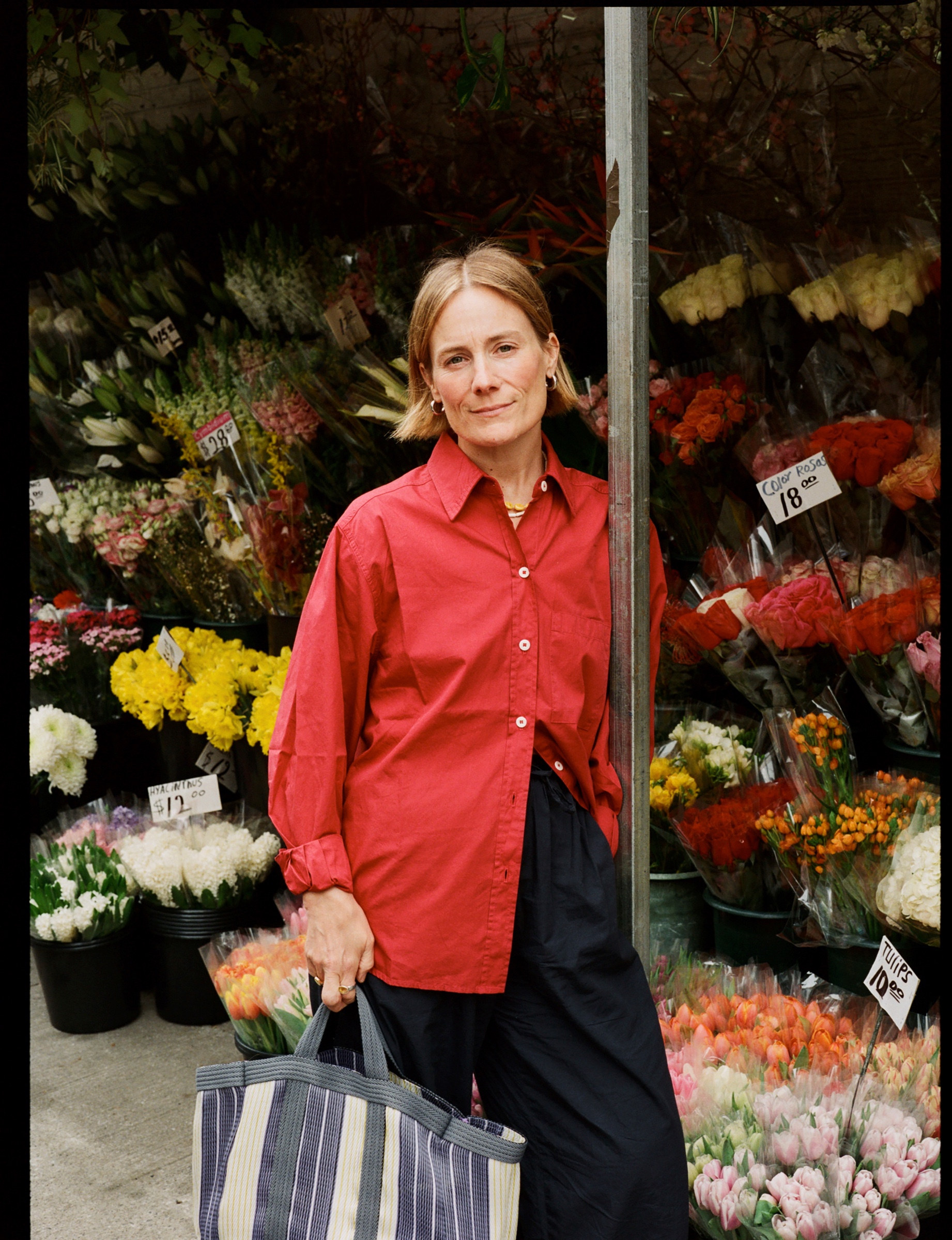Chloe standing in front of a flower market